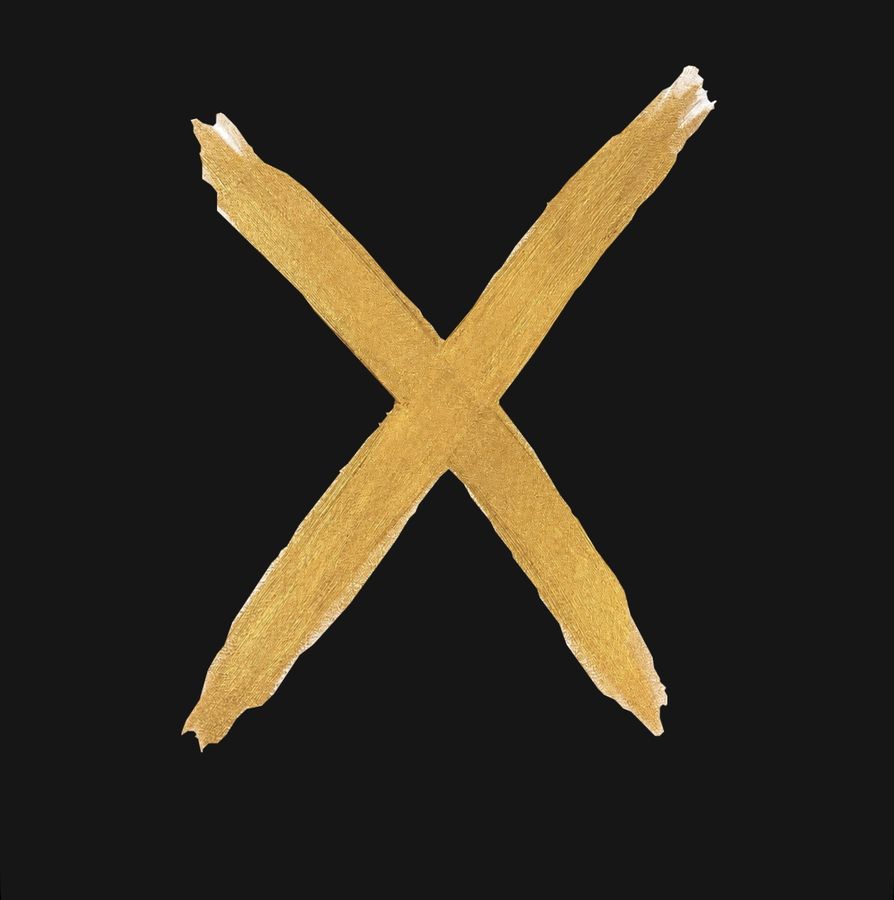 A gold X painted on black, by Johnny X